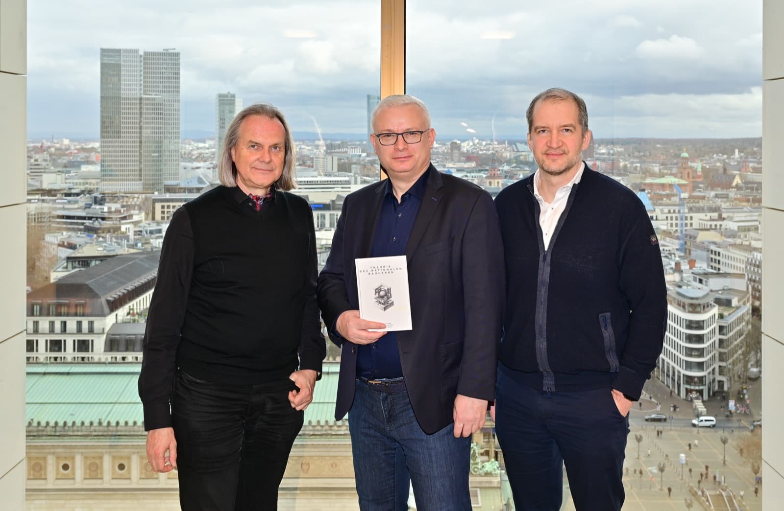 The authors of “Theorie des rationalen Bauherrn” with the book